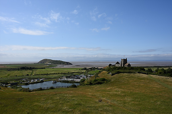 Church, lake and sea by a hill