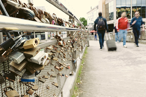 Padlocks on Bridge with Blurred people in the background